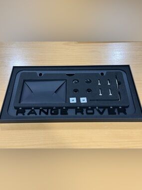 New ( open box) RR Black License Plate Frame with accessories.